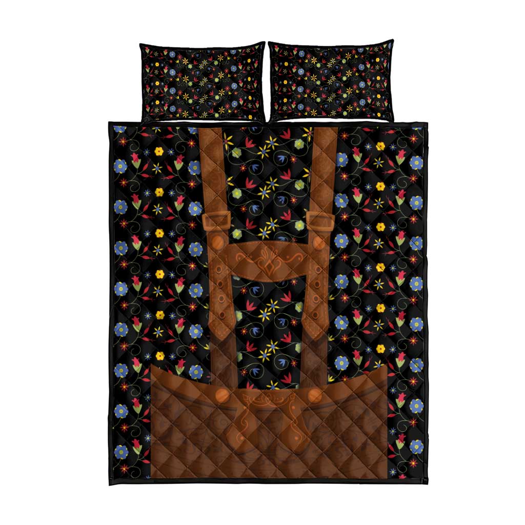 Black quilt bed set with brown patchwork panel and multicolor folk floral pattern; pillows