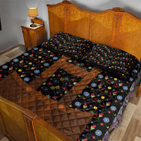 Black quilt bed set with brown patchwork and multicolor folk floral print on bed and pillows