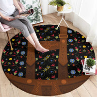 Round folk floral rug with black center panel and brown lederhosen-style accents