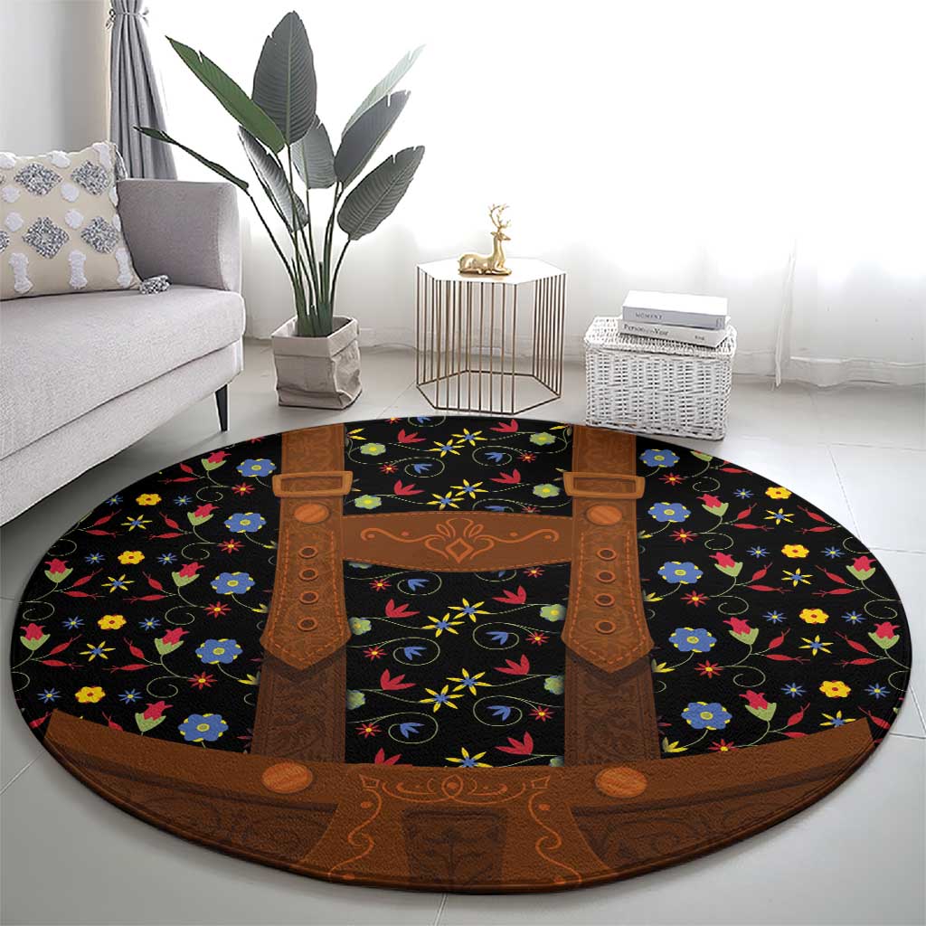 Round folk floral rug with black background, brown lederhosen apron motif and colorful flowers