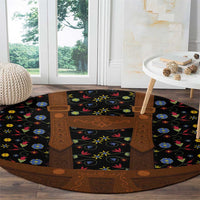 Round folk floral rug with black-and-brown lederhosen motif, colorful flower pattern