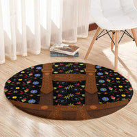 Round folk floral rug with black base, brown central apron panels, circular edges