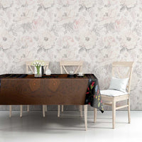 Black folk floral tablecloth with brown lederhosen-style center panel and multicolor blooms