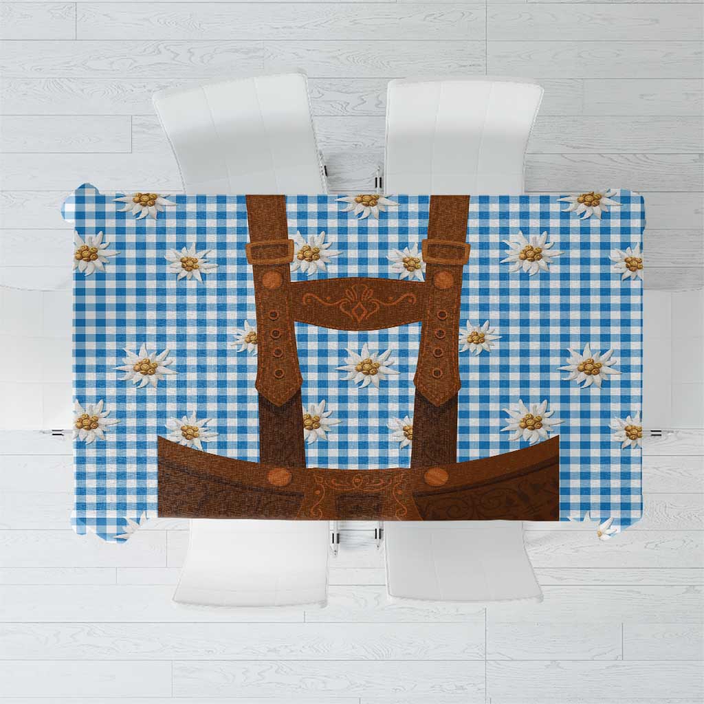 Blue check tablecloth with brown lederhosen graphic and white edelweiss flowers