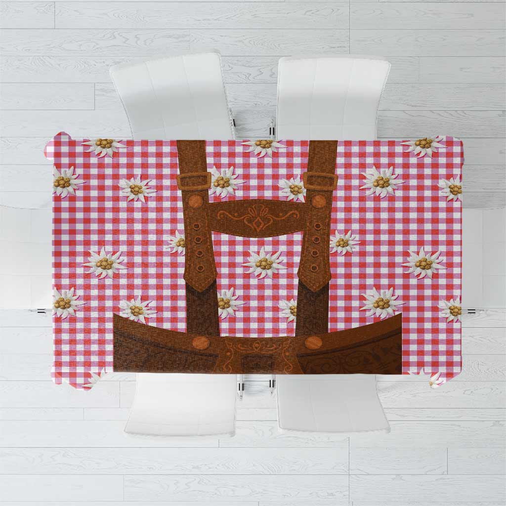 Red and white plaid tablecloth with brown lederhosen-style graphic and edelweiss flowers