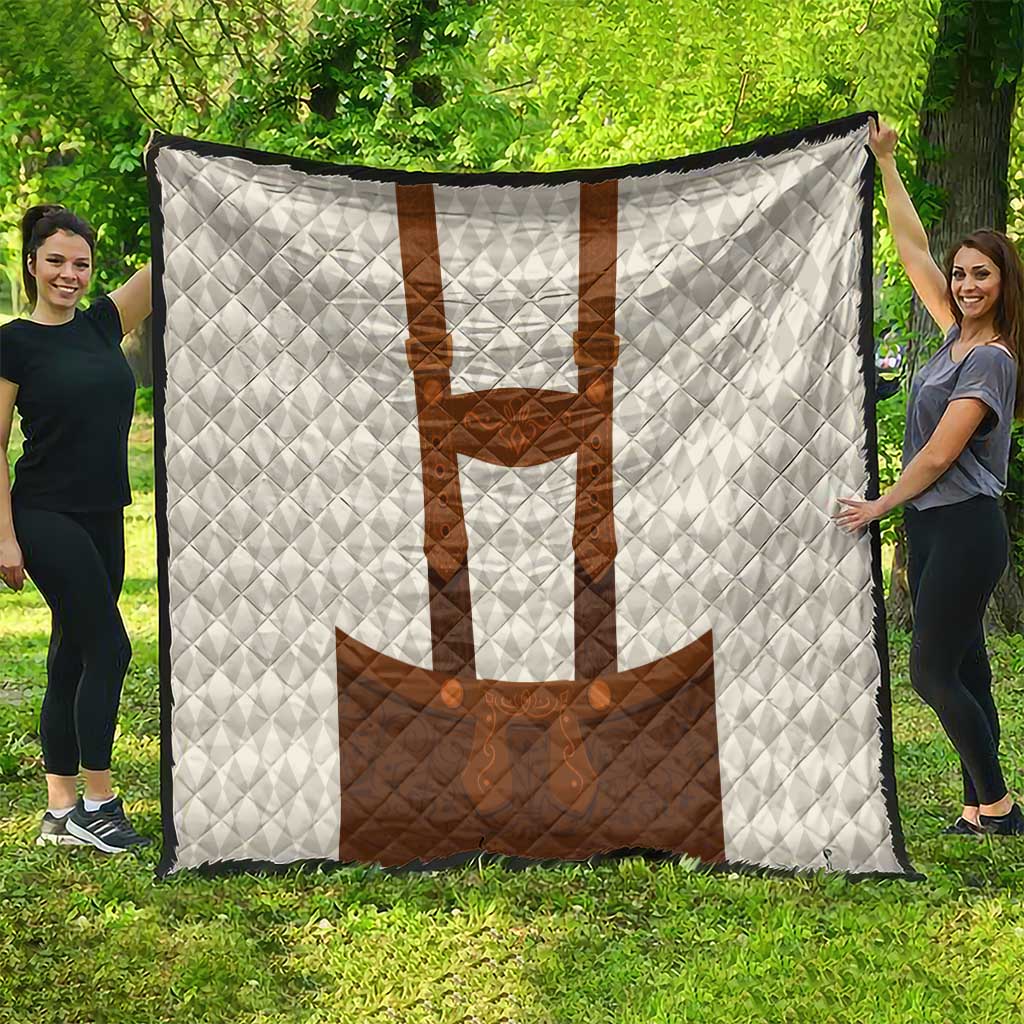 Large white quilt blanket with brown lederhosen motif, quilted diamond texture