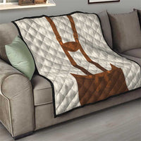 Brown and white quilt blanket on sofa with lederhosen applique and diamond quilting