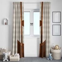 Beige diamond-pattern window curtain panels with brown lederhosen graphic at center