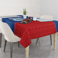 Red and blue Slovakia themed tablecloth, draped over dining table with plants