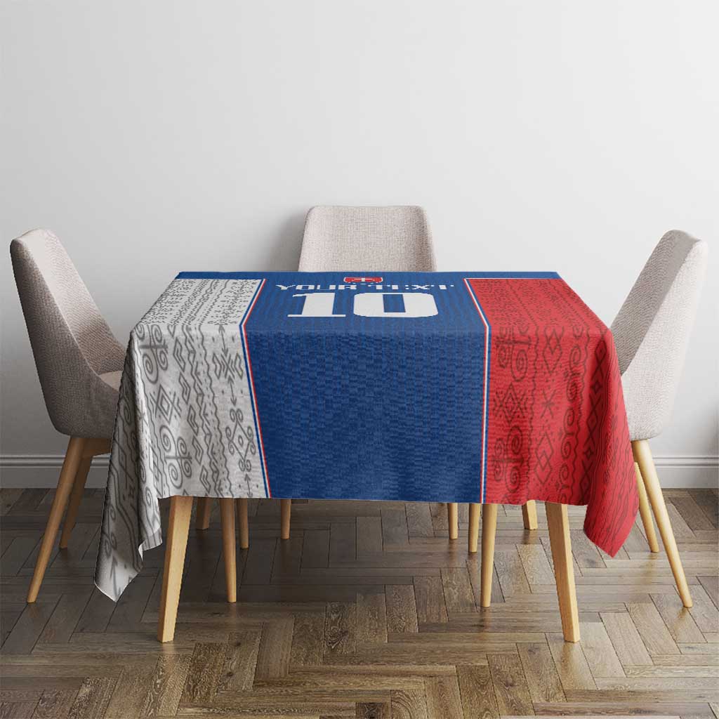 Blue and red Slovakia themed tablecloth on dining table with four chairs