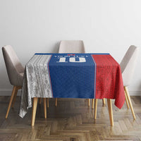 Blue and red Slovakia themed tablecloth on dining table with four chairs