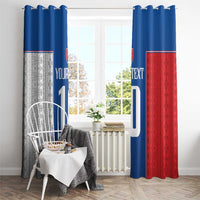 Window curtains with blue-and-red sections and large printed white number design