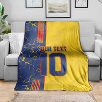 Yellow and navy football blanket showing “YOUR TEXT” and number 10, corner drape.