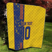 Yellow quilt blanket with blue panel, custom text and number 10, neatly draped