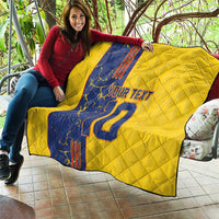 Yellow quilt blanket with blue panel, custom text and number 22 print, held open