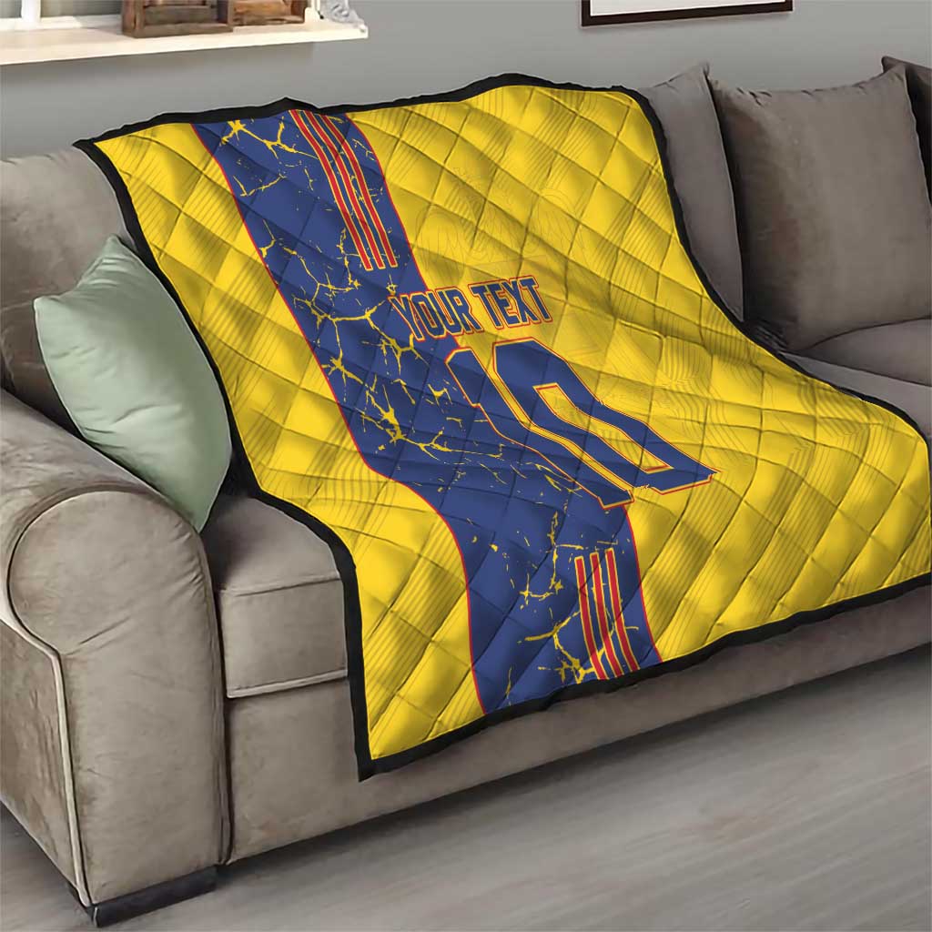 Yellow quilt blanket on gray sofa with blue panel, custom text and number 22 print