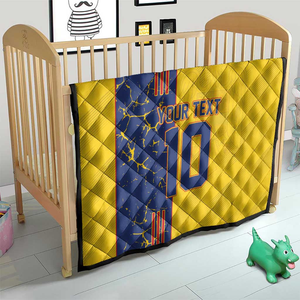 Yellow quilt blanket on wooden crib with blue panel, custom text and number 10