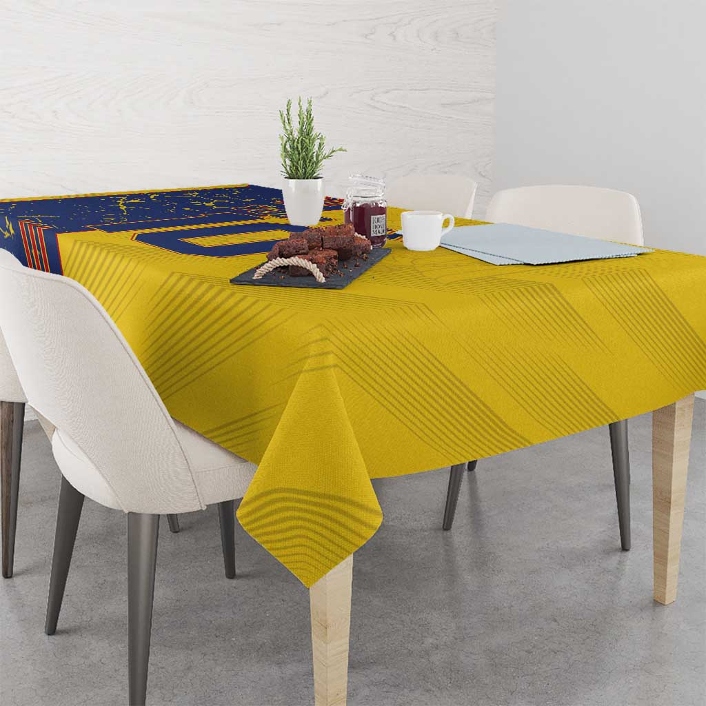 Yellow tablecloth with blue panel design covering a rectangular dining table