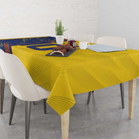 Yellow tablecloth with blue panel design covering a rectangular dining table