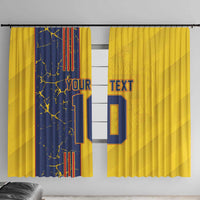 Pair of yellow and navy curtains with bold number 10 and custom text, hanging hardware visible