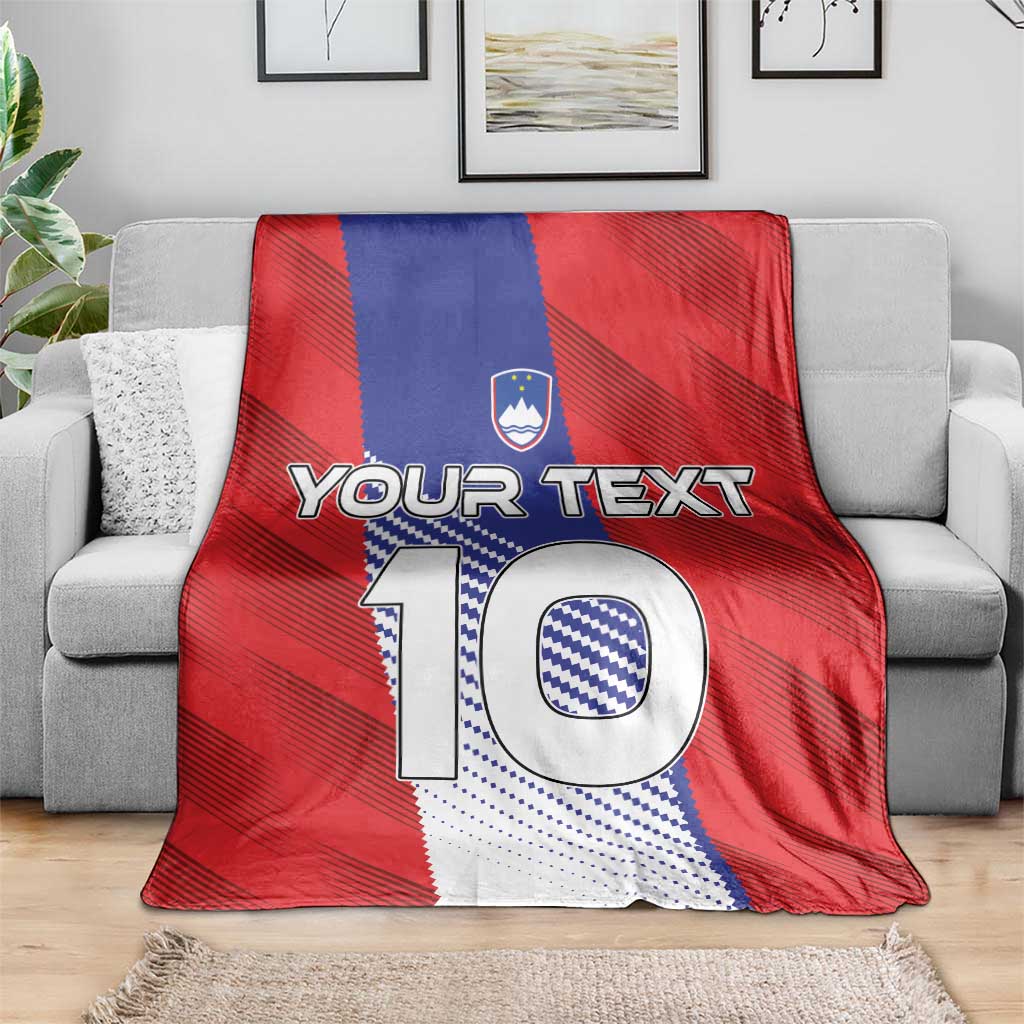 Red and blue football blanket on gray sofa, featuring crest, “Your Text,” and large “10”