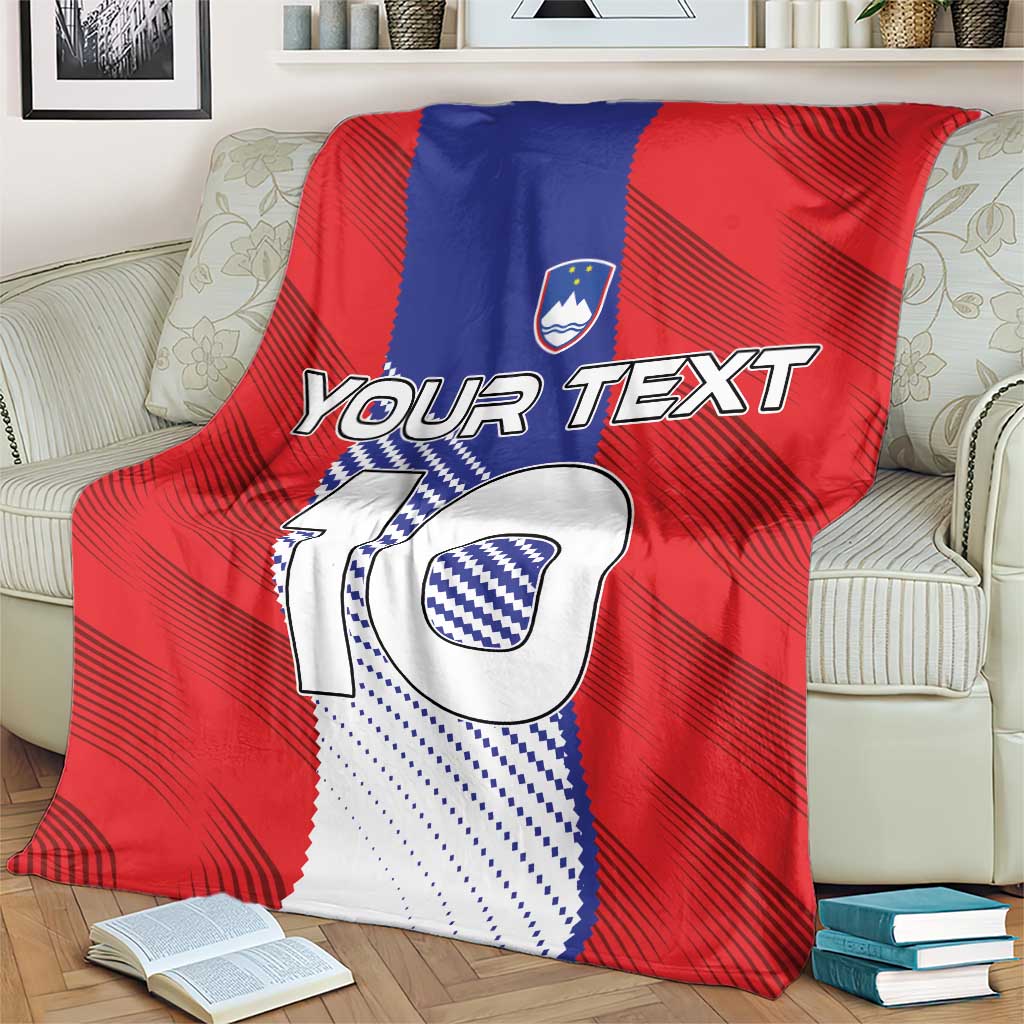 Red football blanket on cream armchair, with “Your Text” and crest above big “10”