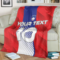 Red football blanket on cream armchair, with “Your Text” and crest above big “10”