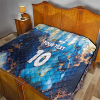 Blue football quilt on bed with Argentina map graphics, 'YOUR TEXT' and '10'
