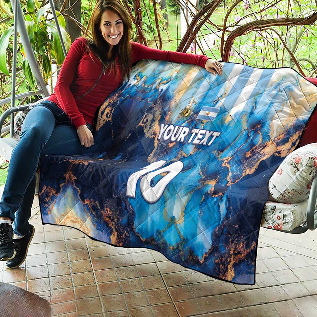 Blue football quilt on couch with Argentina map, 'YOUR TEXT' and large '7' marking