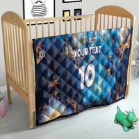 Blue football quilt on baby bed with Argentina map, 'YOUR TEXT' and '10' number