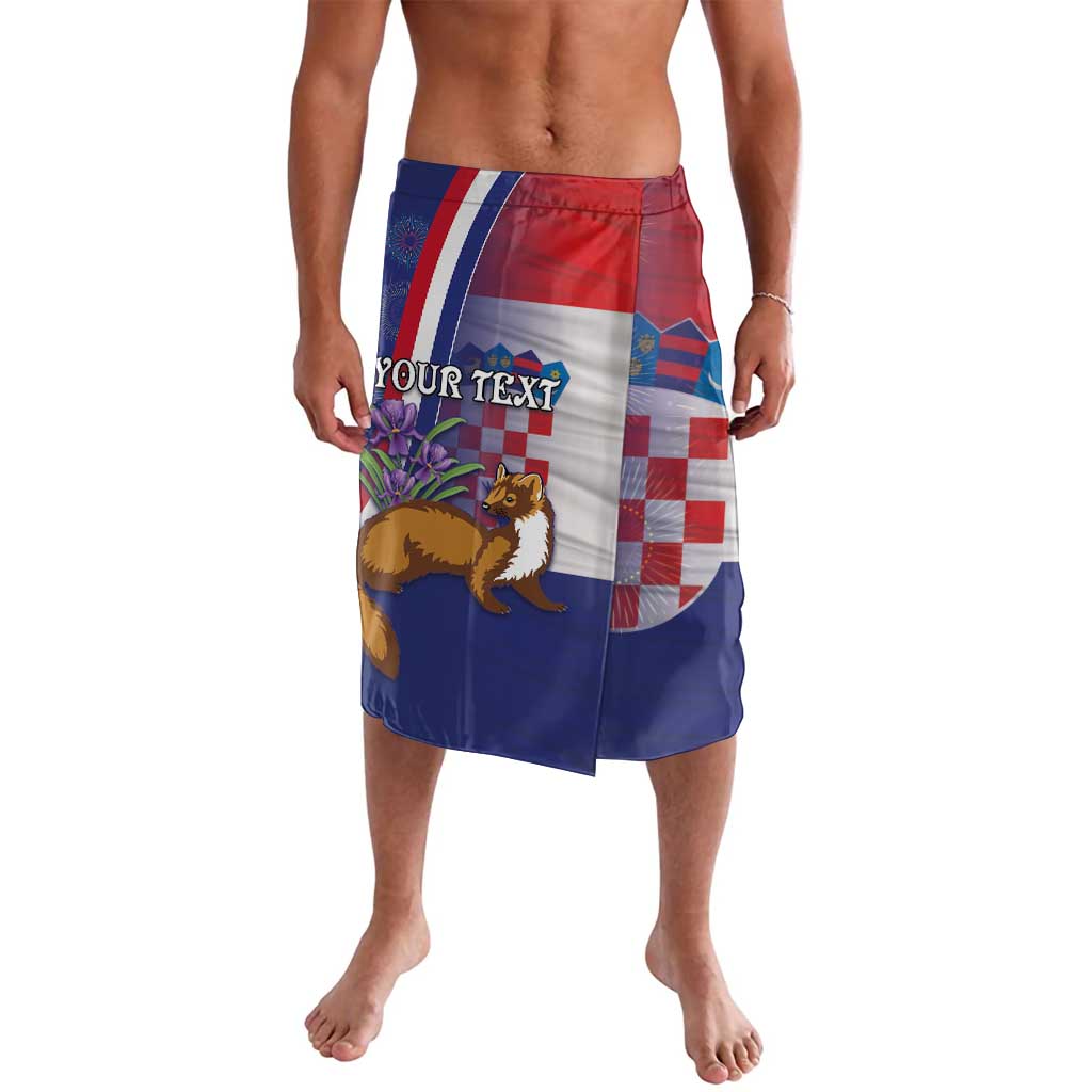 Blue knee-length wrap skirt with red border stripe, checkerboard panel, and plant-and-lion print
