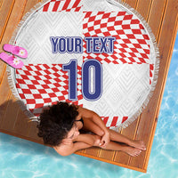 Round beach blanket laid flat, fringe edge, red/white checks, 'YOUR TEXT' and 10