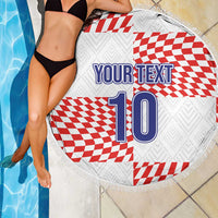 Circular beach blanket draped by pool, fringe edge, red/white checks, 'YOUR TEXT' and 10
