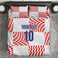 White bedding set with red check blocks, “YOUR TEXT” and number “10” on duvet