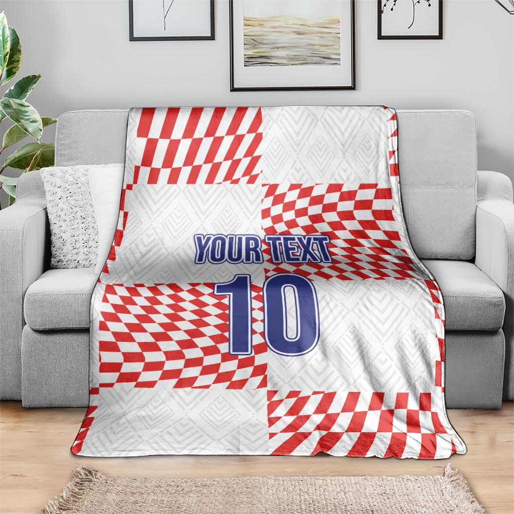 Custom football blanket draped on a sofa, red-and-white checkered pattern with “YOUR TEXT” 10