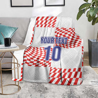 Custom football blanket on a rug with red-and-white checkered design, “YOUR TEXT” 10