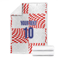 Custom football blanket folded with red-and-white checkered pattern, “YOUR TEXT” and number 10