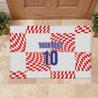 White rubber doormat with red checkered design, blue “YOUR TEXT” and number 10