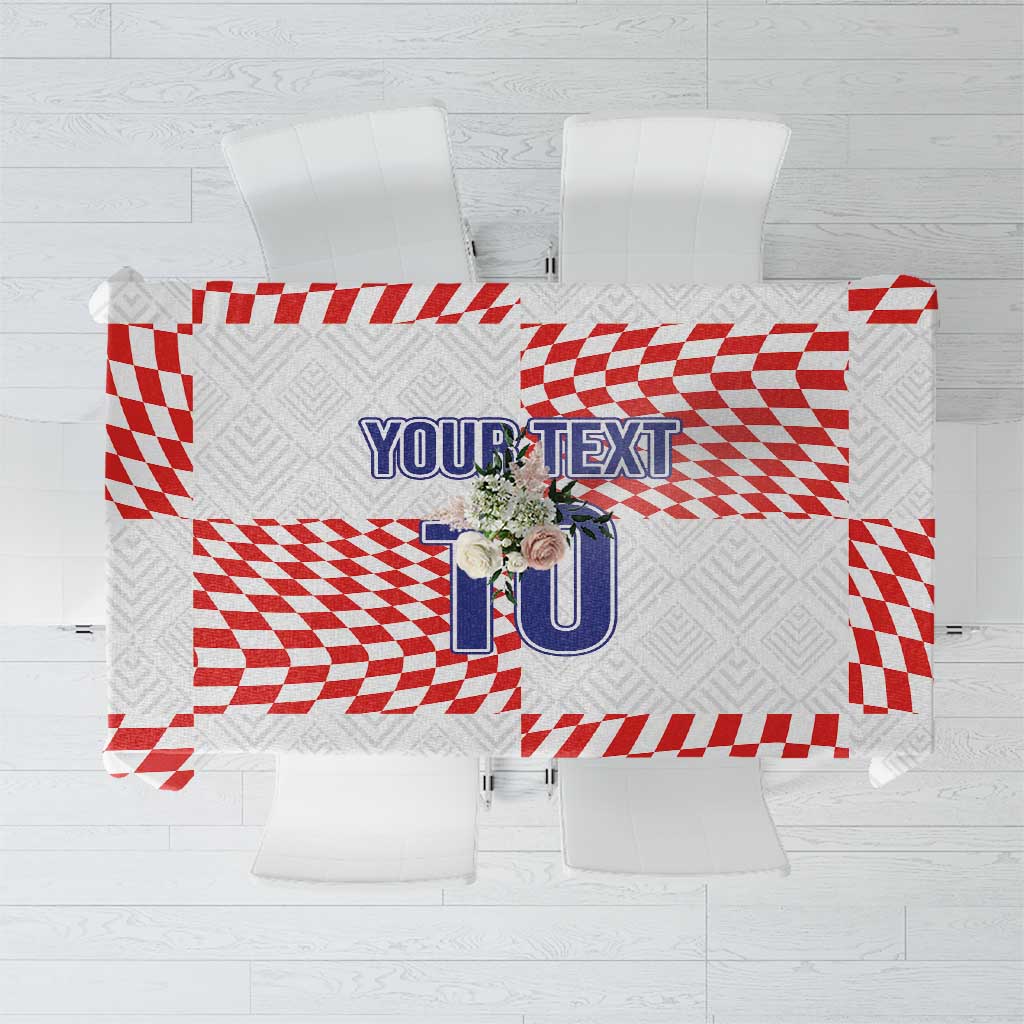 White tablecloth with red checker and stripe football-themed print and custom text area