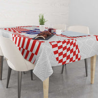 White tablecloth with red checker pattern and football-themed design
