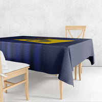 Barbados flag tablecloth draped on table, navy blue with yellow diagonal cross