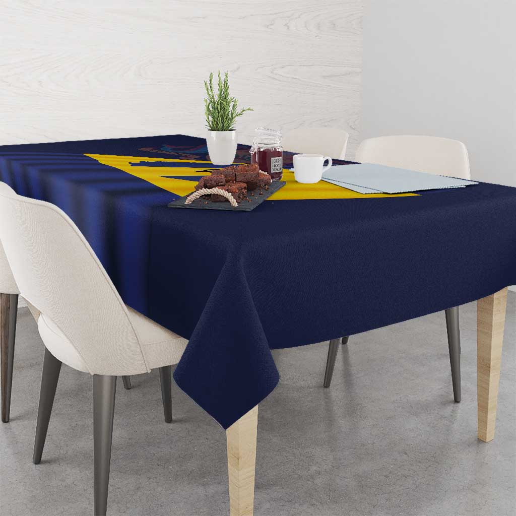 Barbados flag tablecloth on dining table with navy blue fabric and yellow diagonal stripe