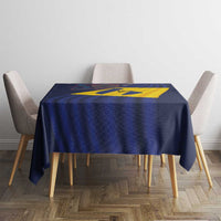 Barbados flag tablecloth on round table, navy blue with centered yellow diagonal cross
