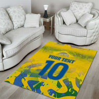 Yellow area rug in living room, 'YOUR TEXT' and large blue '10' on front.