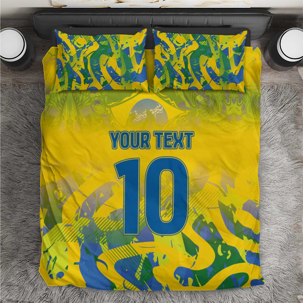 Yellow football bedding set, blue-green camo pattern with 'YOUR TEXT' and large '10' on bed.