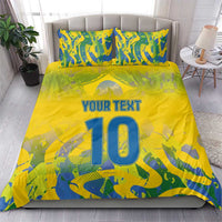 Yellow football bedding set with blue-green camo design, 'YOUR TEXT' and large '10' blanket.