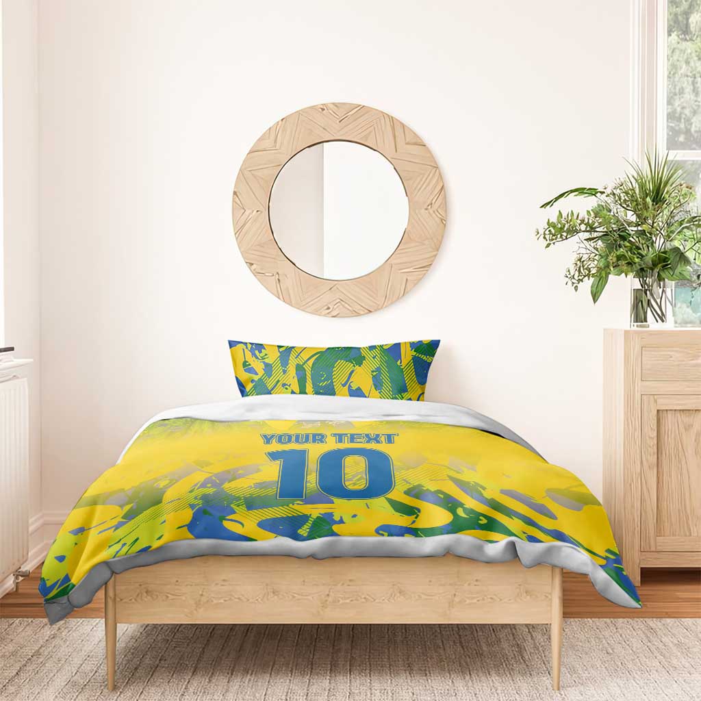 Yellow football bedding set with blue-green camo print, 'YOUR TEXT' and large '10', on bed.