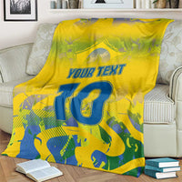 Yellow personalized blanket on sofa with “YOUR TEXT” and blue number 10