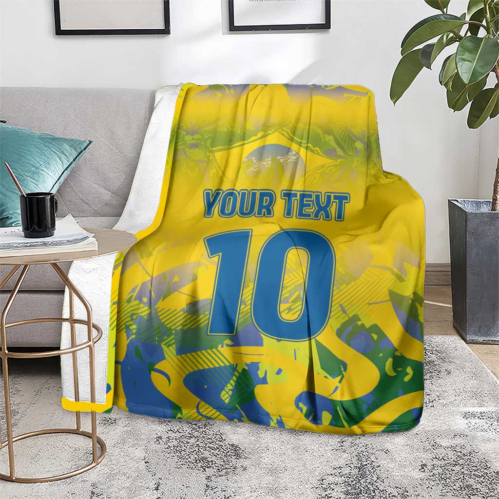 Yellow football blanket with “YOUR TEXT” and blue number 10, folded over seat