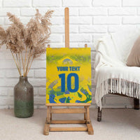Yellow canvas wall art showing custom text and blue number 10, on wooden easel